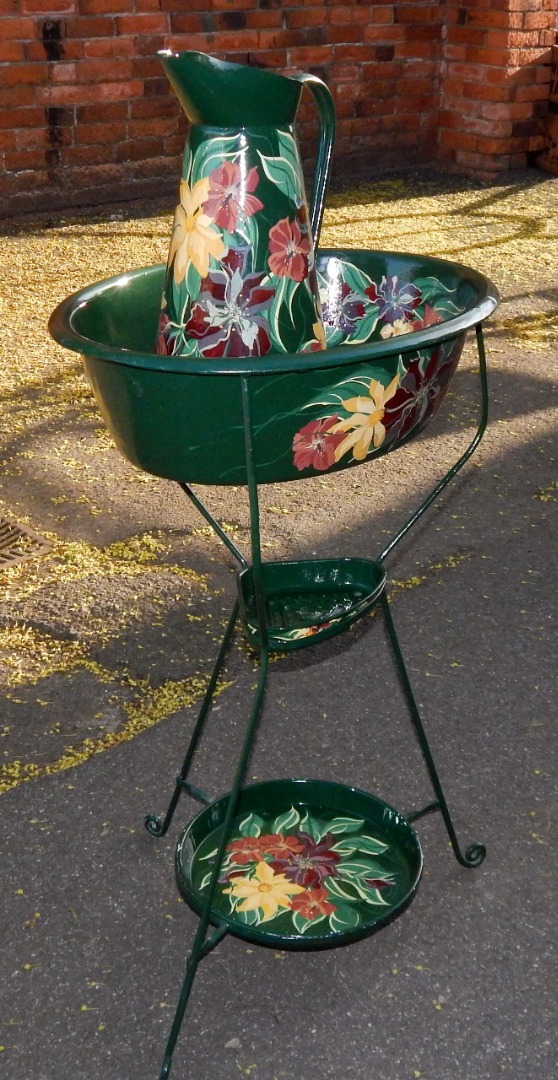 Appraisal: A bargeware type floral painted green wash jug bowl and