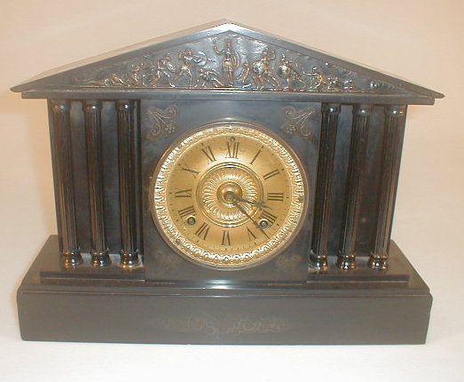 Appraisal: A Victorian black slate mantel clock an day movement striking