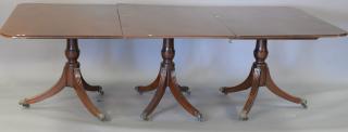 Appraisal: Mahogany triple pedestal dining table with two leaves ht in