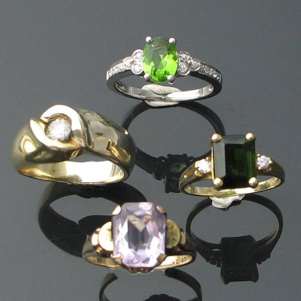 Appraisal: A collection of four diamond gem-set and gold rings estimated