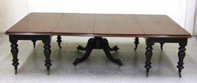 Appraisal: AN IRISH MAHOGANY DINING TABLE of rounded oblong form with