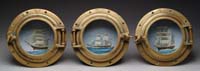 Appraisal: SET OF THREE BRASS PORTHOLES Identical having heavy hinged glass