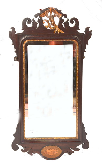 Appraisal: A GEORGIAN STYLE MAHOGANY FRET FRAME WALL MIRROR with gilt