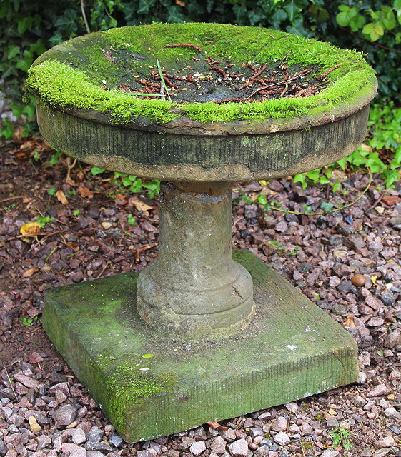 Appraisal: AN OLD YORKSTONE FOUNTAIN OR BIRD TABLE a shallow bowl