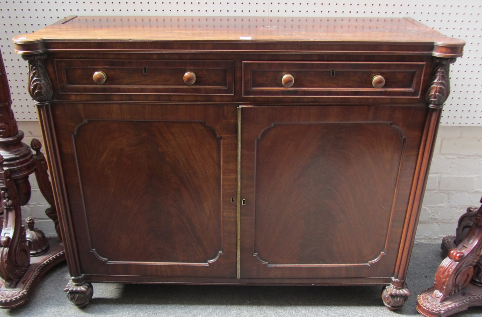 Appraisal: A William IV mahogany side cabinet the pair of drawers