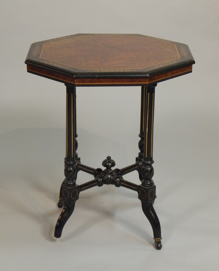 Appraisal: A Victorian aesthetic style ebonised occasional table the octagonal top