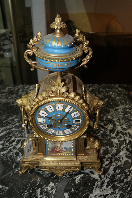 Appraisal: A FRENCH GILT METAL AND PORCELAIN MANTEL CLOCK the movement