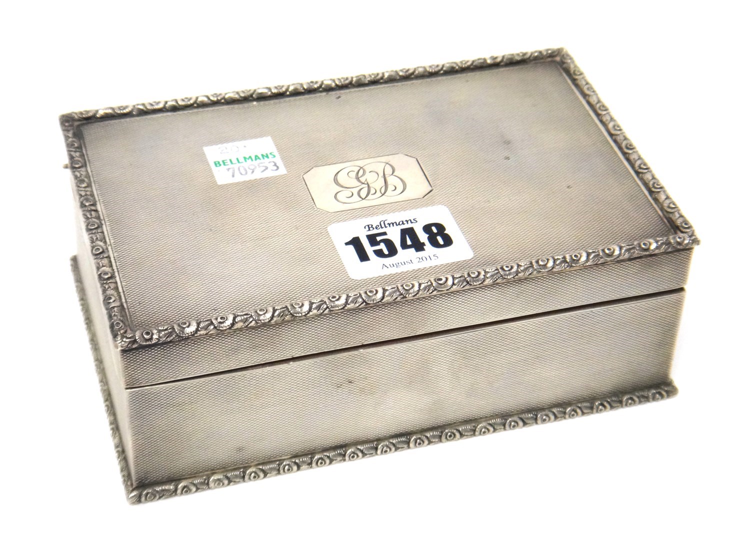 Appraisal: A silver rectangular table cigarette box the cover and the