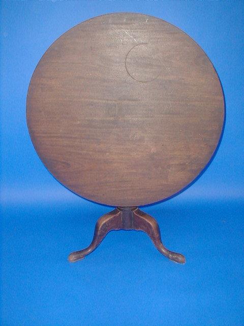 Appraisal: A George III mahogany supper table with circular tilt top