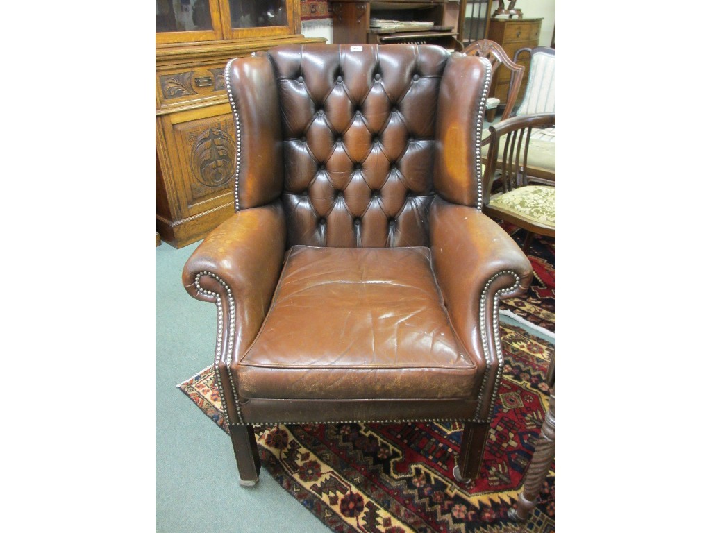 Appraisal: Georgian style leather button back library armchair