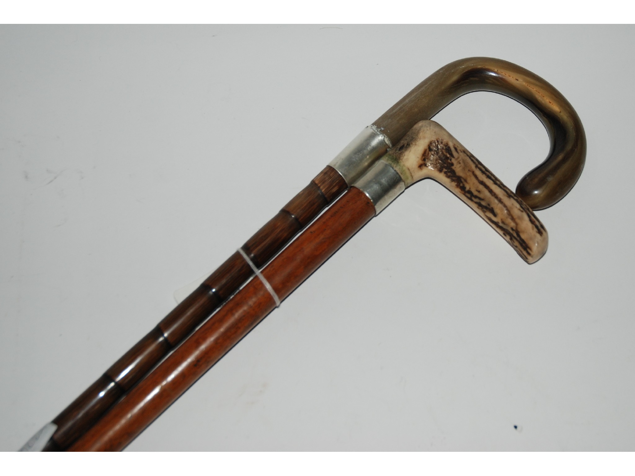 Appraisal: Two horn handle walking canes