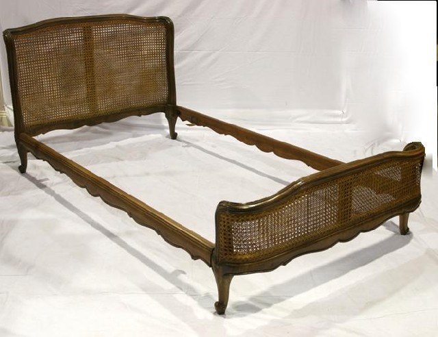 Appraisal: A pair of Louis XV style single beds in walnut