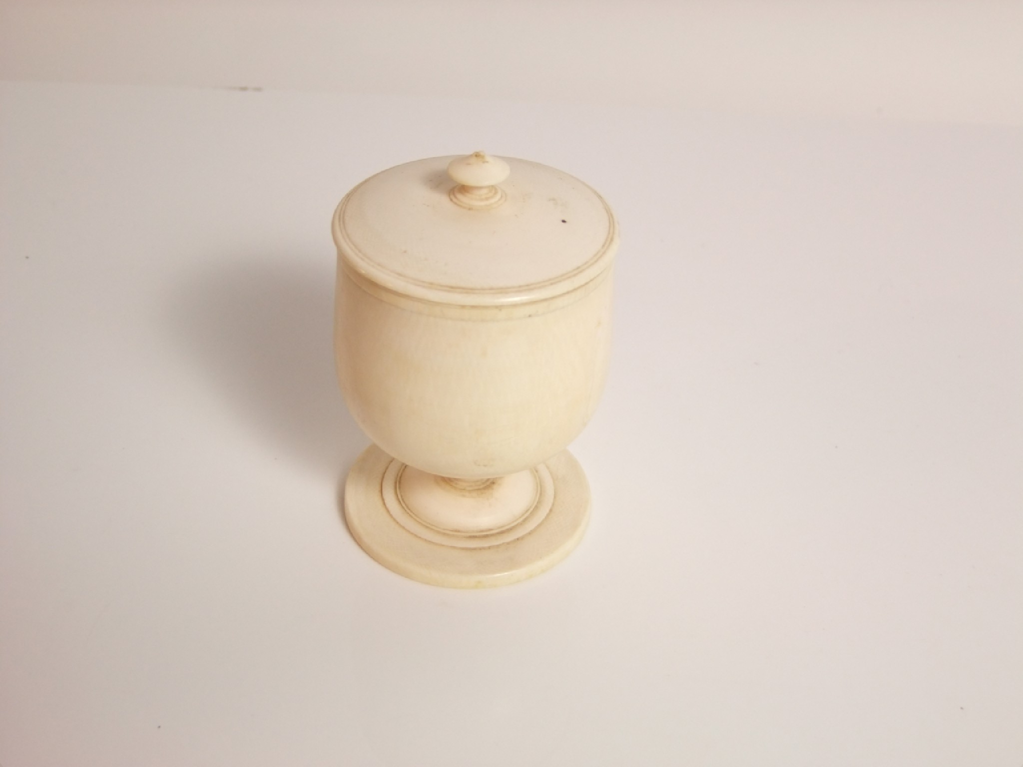 Appraisal: A turned ivory cup and cover late th century cm