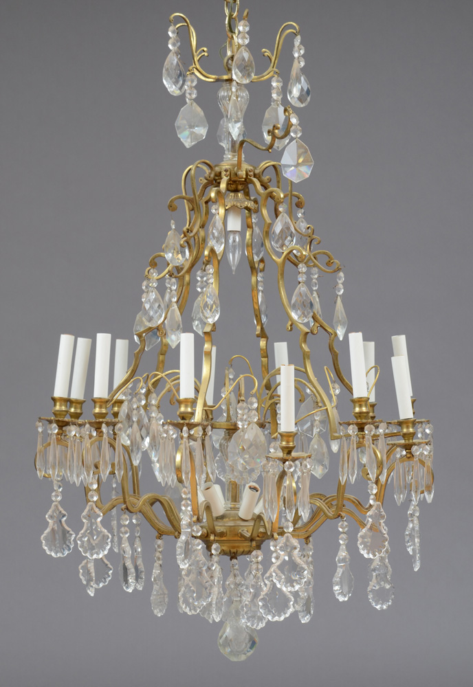 Appraisal: LOUIS XV STYLE GILT-METAL AND FACETED GLASS TWELVE-LIGHT CHANDELIER The