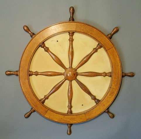 Appraisal: Oak ship s wheel reconstructed as a wall hanging dia