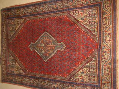 Appraisal: AN ANTIQUE NORTH WEST PERSIAN RUG the red lozenge shaped