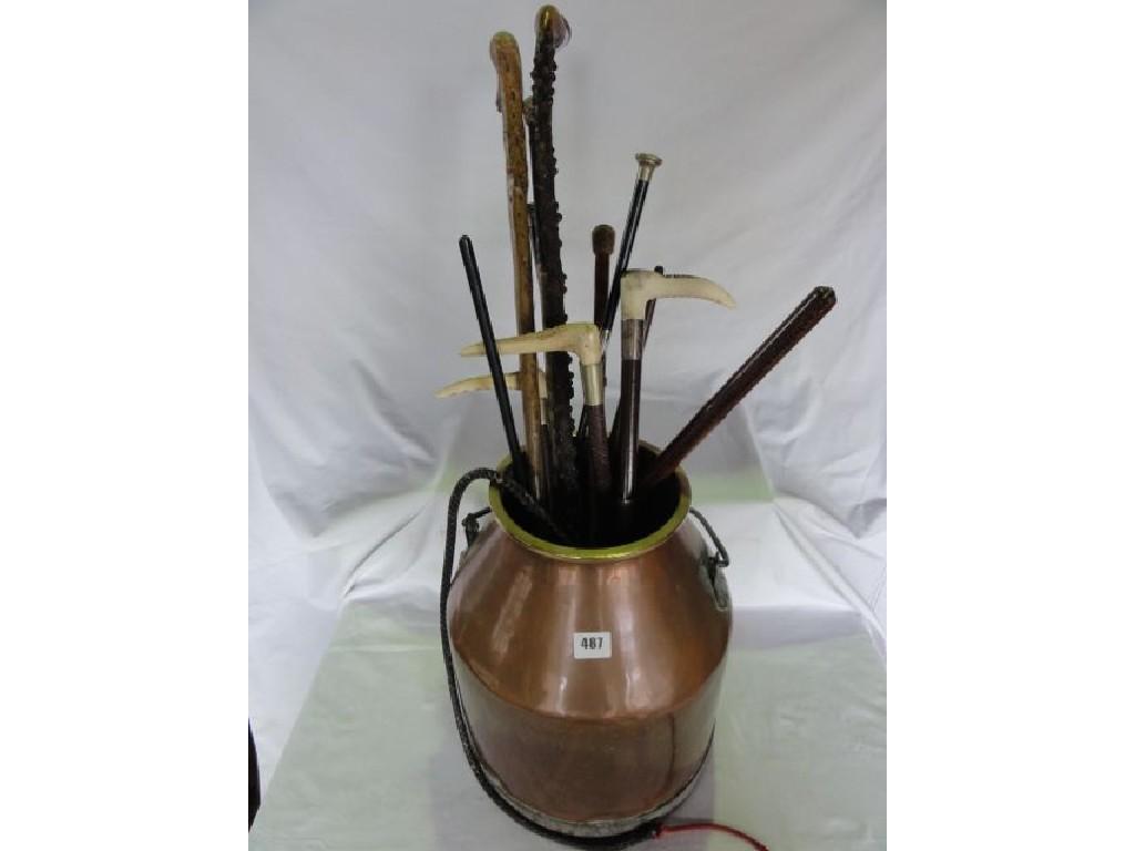 Appraisal: A copper churn containing a miscellaneous collection of walking sticks