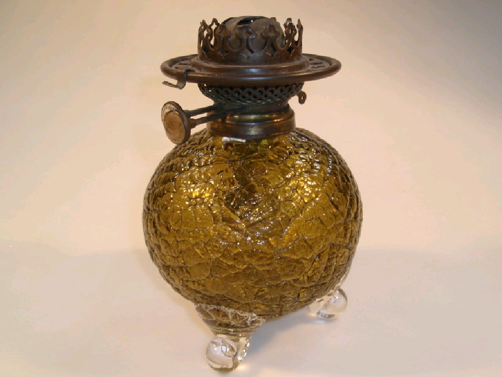 Appraisal: An amber glass oil lamp base of spherical form on