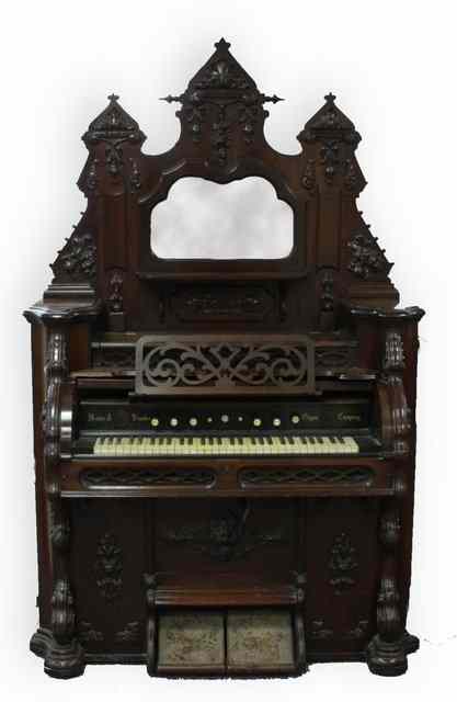 Appraisal: A harmonium with mirror back superstructure and cylinder front cm