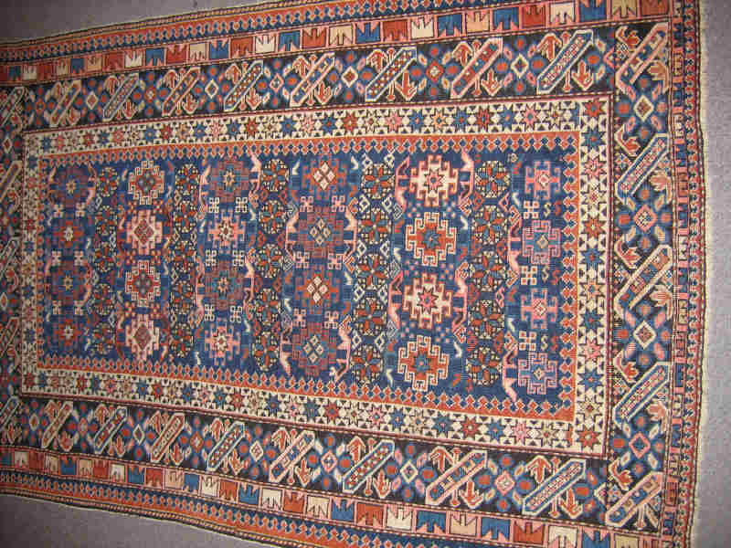 Appraisal: CAUCASIAN CHI CHI THROW RUG The indigo field with allover