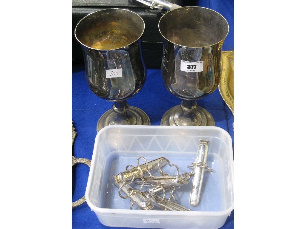 Appraisal: Lot comprising two EP goblets and a set of clips