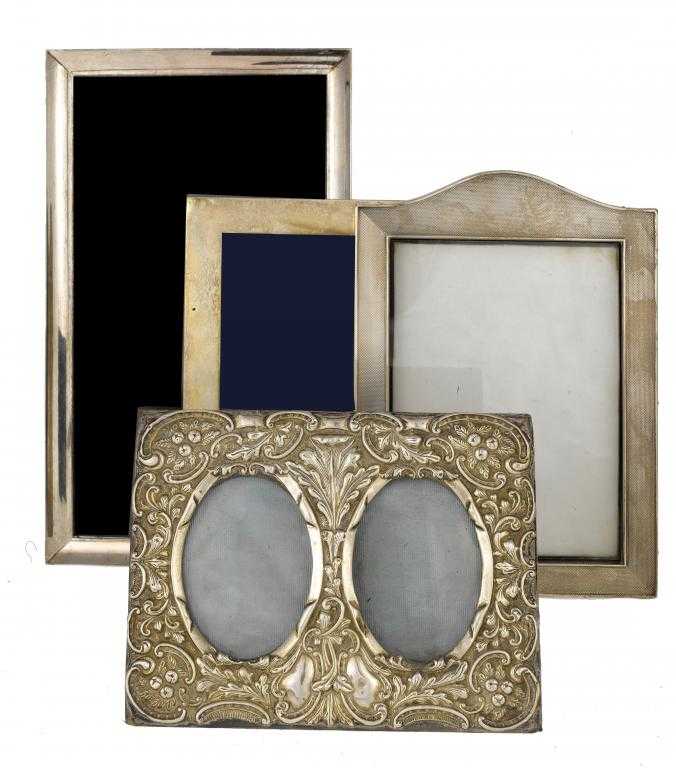 Appraisal: FOUR VICTORIAN AND LATER PHOTOGRAPH FRAMES the earliest a double