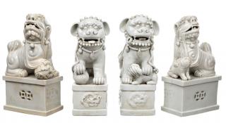 Appraisal: A GROUP FEATURING TWO PAIRS OF BLANC-DE-CHINE LIONS each of