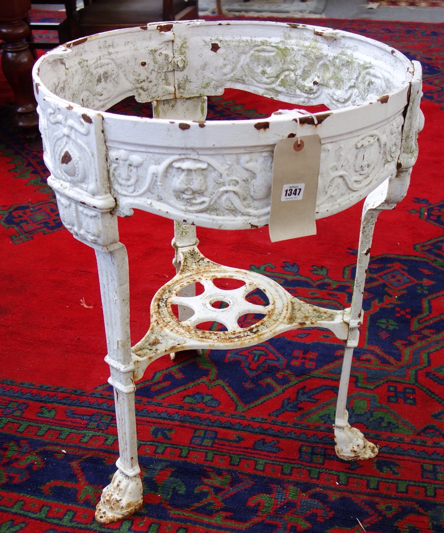 Appraisal: An Art Nouveau circular cast iron table base with moulded