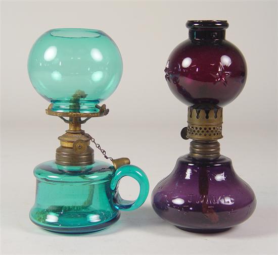 Appraisal: Two Miniature Oil Lamps Amethyst glass oil lamp with embossed