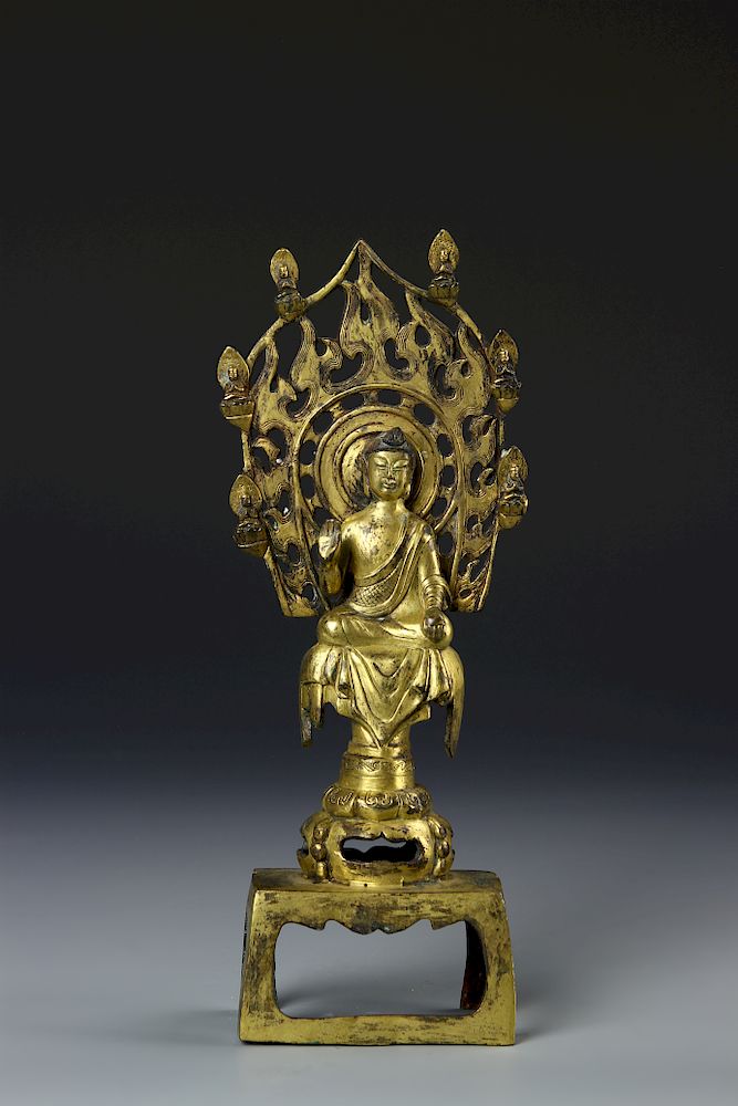 Appraisal: Chinese Gilt-Bronze Figure of Buddha Possible Tang Dynasty seated against