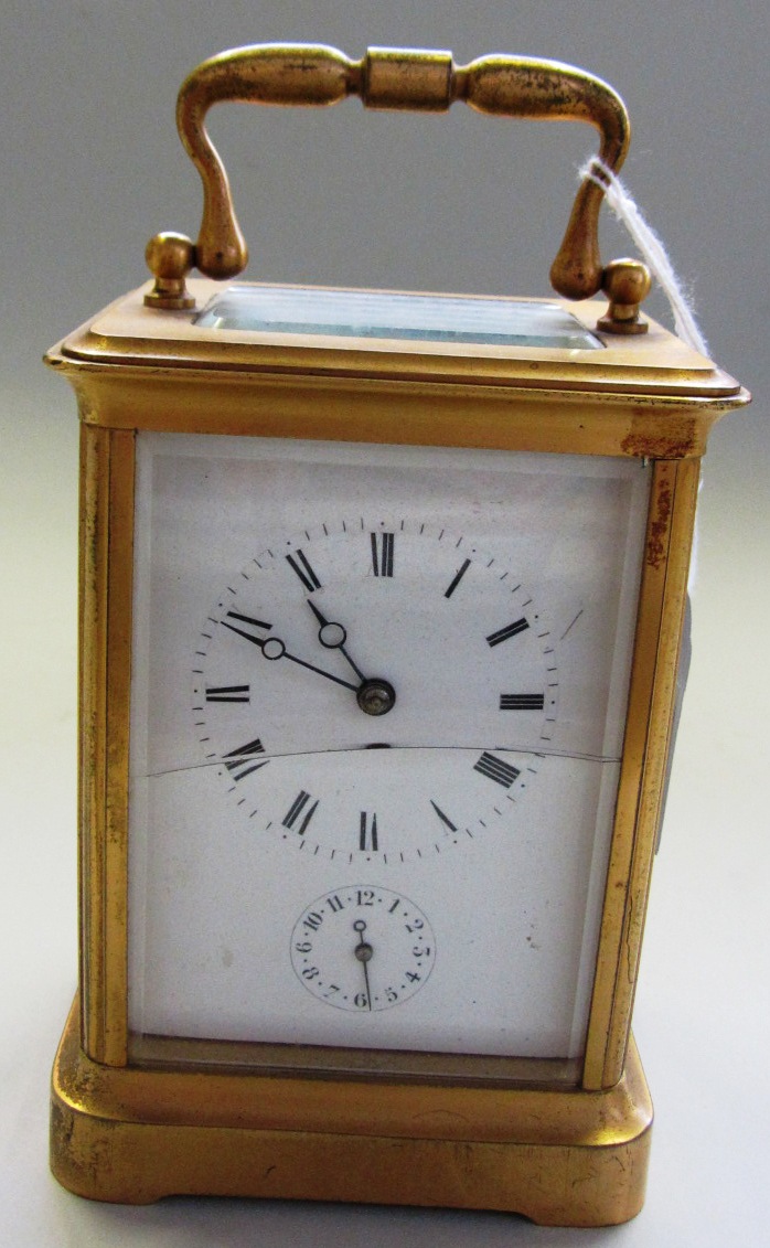 Appraisal: A Victorian gilt brass cased carriage clock the white enamel