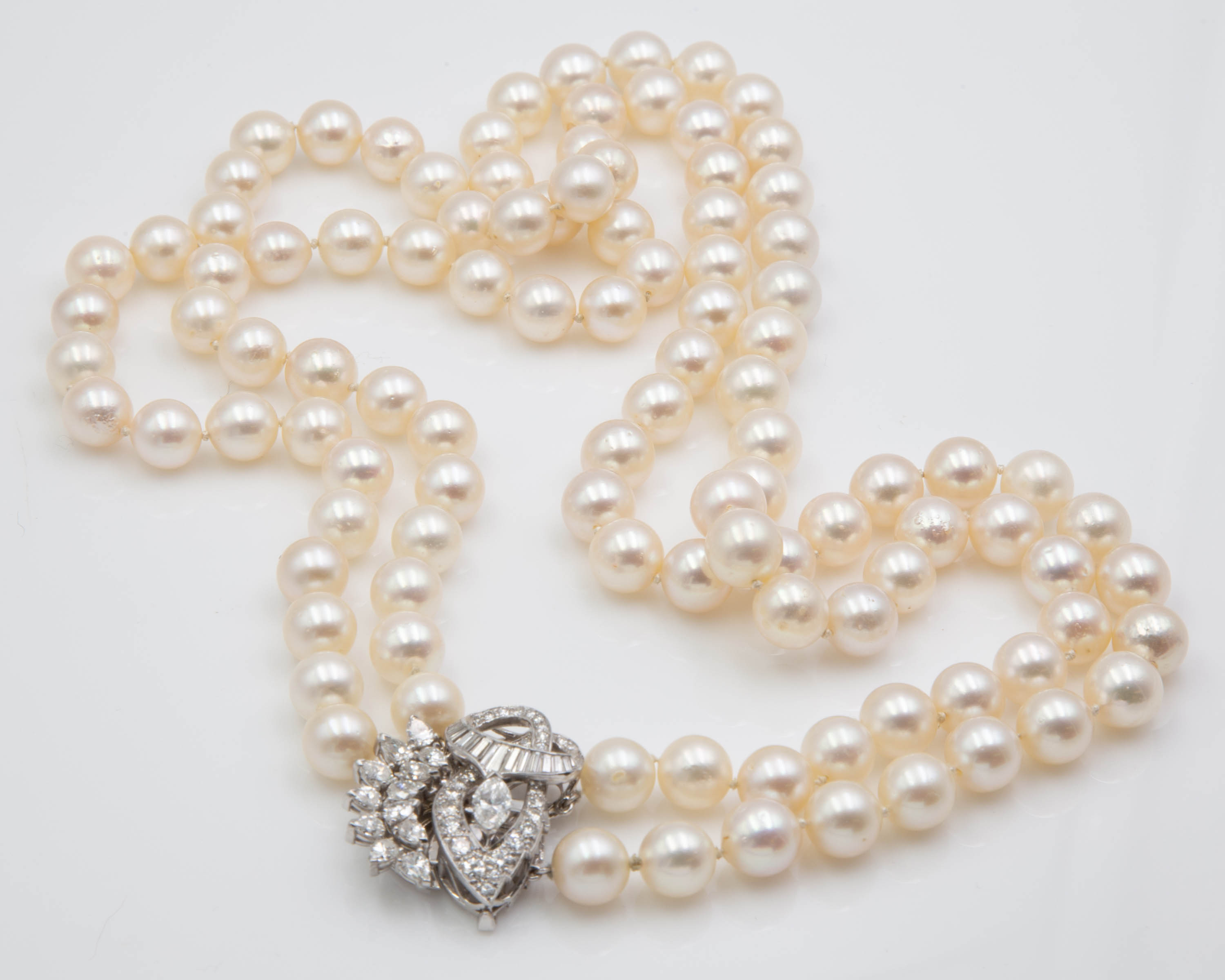 Appraisal: DOUBLE STRAND PEARL NECKLACE WITH K GOLD AND DIAMOND CLASP