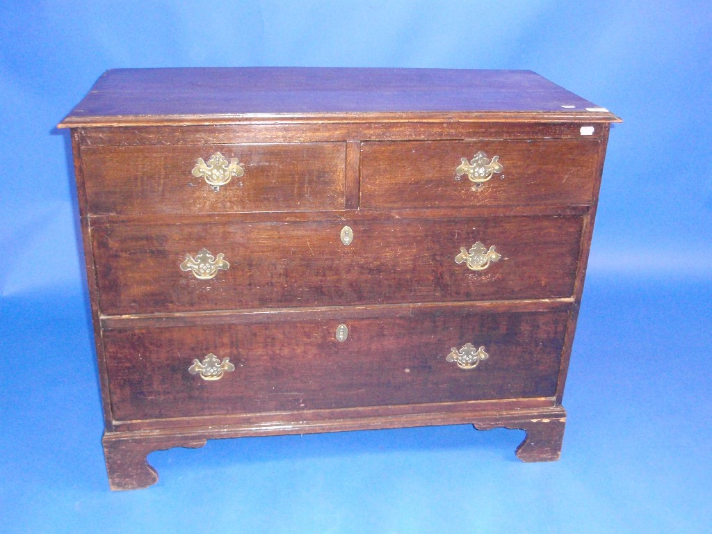 Appraisal: A George III oak chest of two short and two