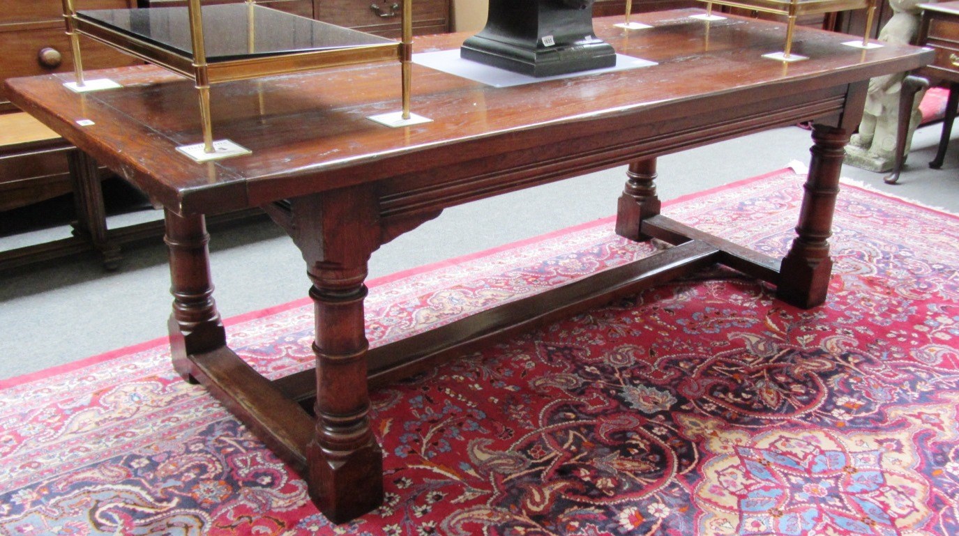 Appraisal: A th century style oak refectory table the plank top