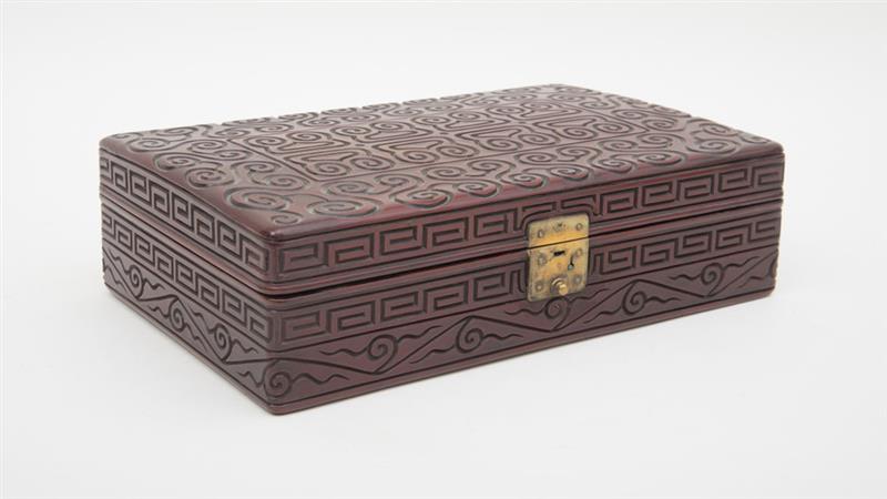 Appraisal: CHINESE CARVED GURI LACQUER BOX The rectangular hinged top with