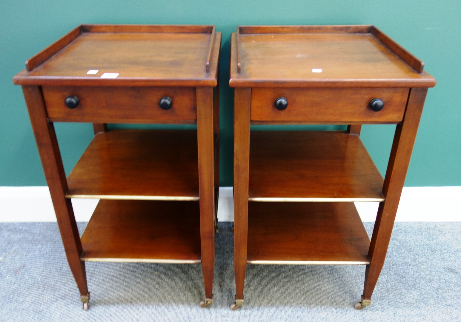 Appraisal: A pair of brass mounted mahogany bedside tables each with