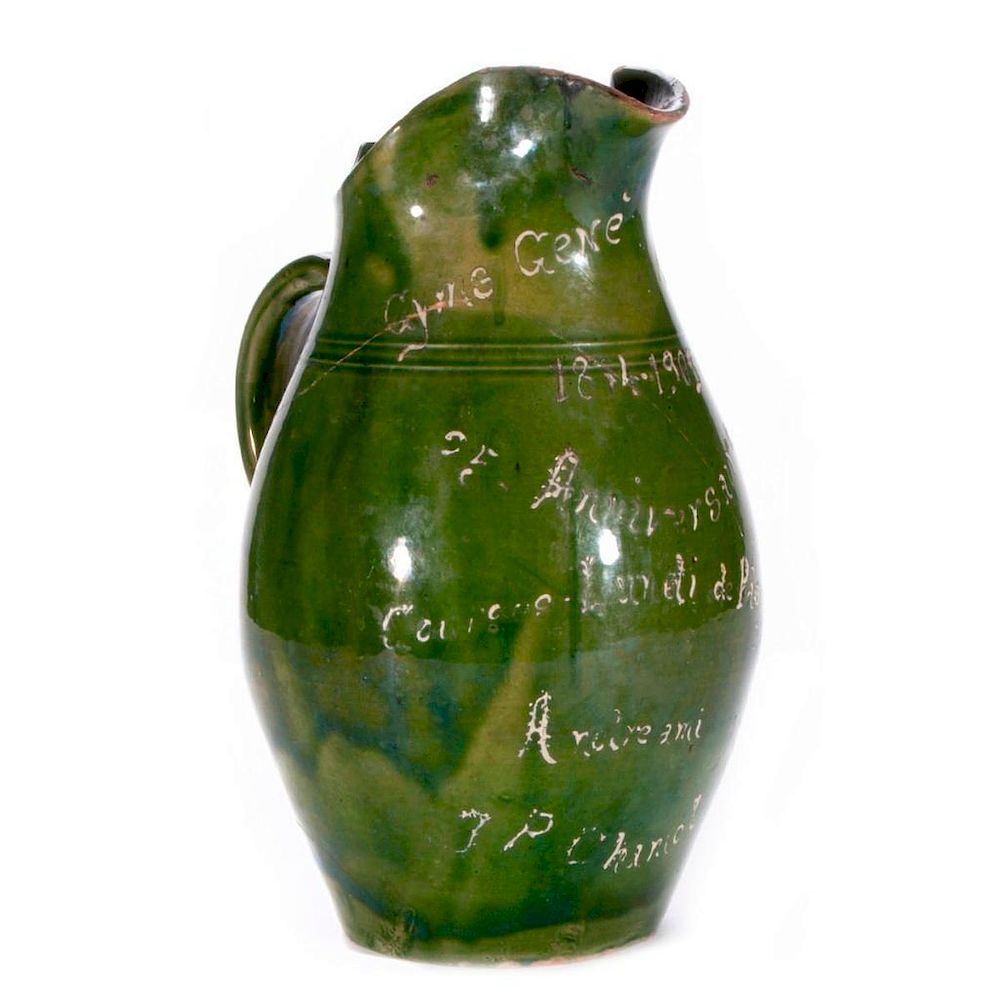 Appraisal: French terracotta pitcher An early th century French green glazed