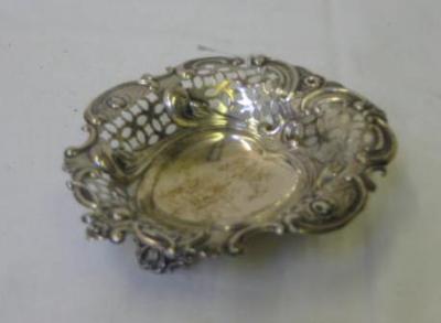 Appraisal: A PIN TRAY of heart form with scroll edged rim