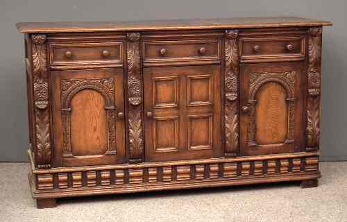 Appraisal: A panelled oak sideboard of '' th Century'' design with