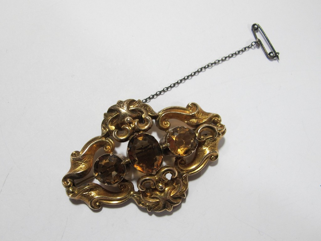 Appraisal: Victorian yellow metal citrine set scroll brooch