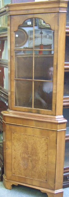 Appraisal: A th century walnut floor standing corner cabinet cupboard the