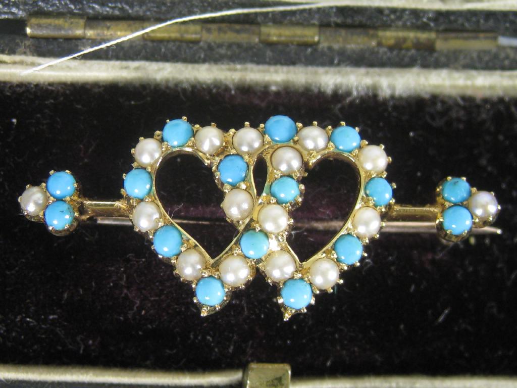 Appraisal: An Edwardian Gold Half-Pearl and Turquoise twinned Heart Brooch alternate