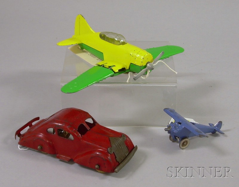 Appraisal: Three Metal Toys a Hubley cast iron airplane with fold-in