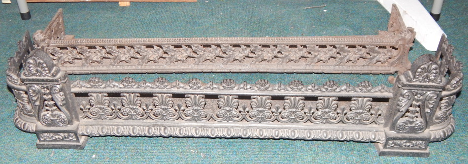 Appraisal: Two Victorian cast iron fenders each with pierced decoration of