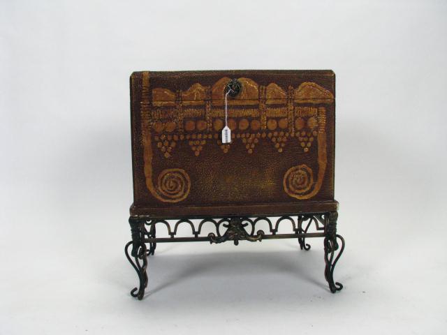 Appraisal: Decorator Trunk on Iron Stand antique style exterior with lion