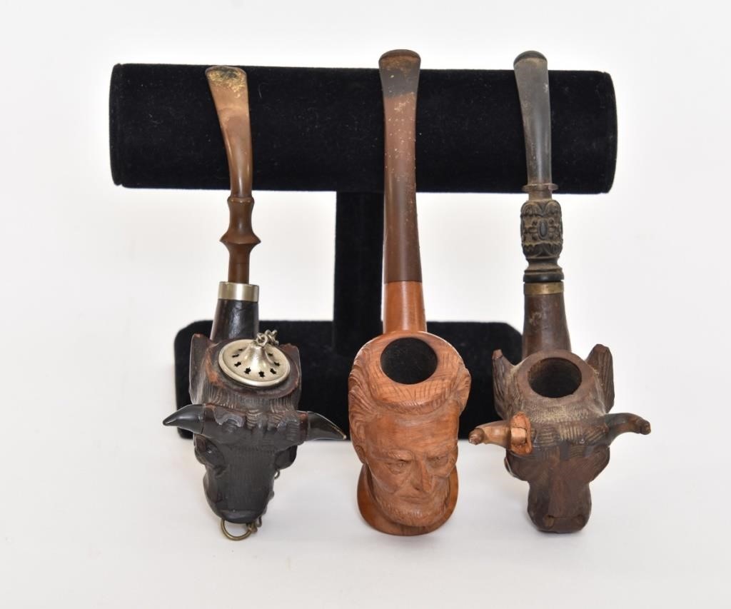 Appraisal: Three carved smoking pipes Algerian Briar France carved pipe of