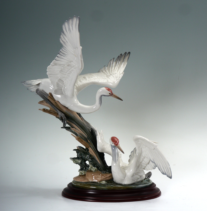 Appraisal: LLADRO PORCELAIN FIGURINE CRANES Salvador Debon sculptor issued Approx ''h