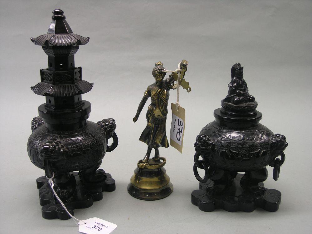 Appraisal: A pair of oriental carved black stone vases the bulbous