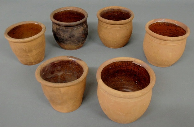 Appraisal: Six unglazed Pennsylvania redware jars th c ea approx h