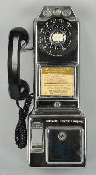 Appraisal: Automatic Electric Chrome -Slot Pay Telephone Circa code number LPC-